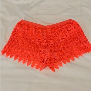 Neon coral crochet shorts